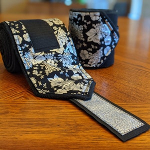 Silver & Black Polo Wraps, Silver foil flowers over black cotton print over black fleece with silver glitter ribbon, flashy and classic
