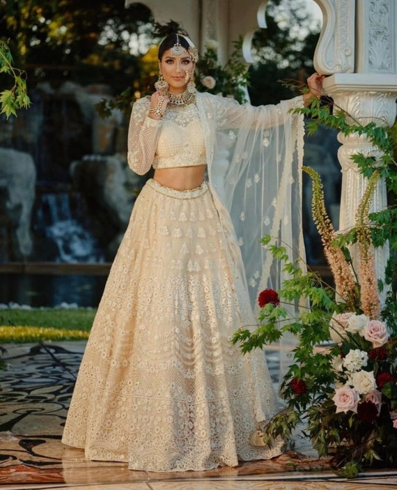 Designer traditional girls off white lucknowi Embroidered Net Wedding Wear Lehenga Choli