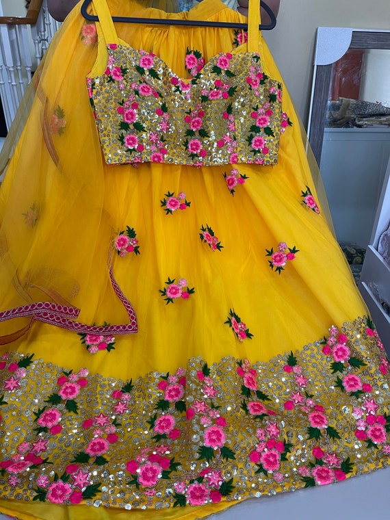 Yellow pink mehndi /haldi net lehenga choli
