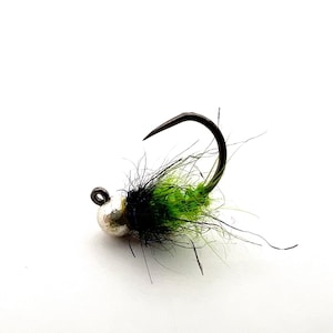 May include: A black and green fly fishing lure with a silver bead head.