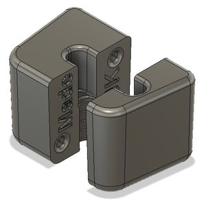 Peut inclure: Un connecteur imprimé en 3D en plastique gris avec le mot "Made" imprimé sur le côté.