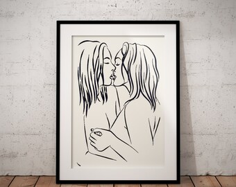 May include: Black and white line art print of two people kissing. The print is framed in a black frame.