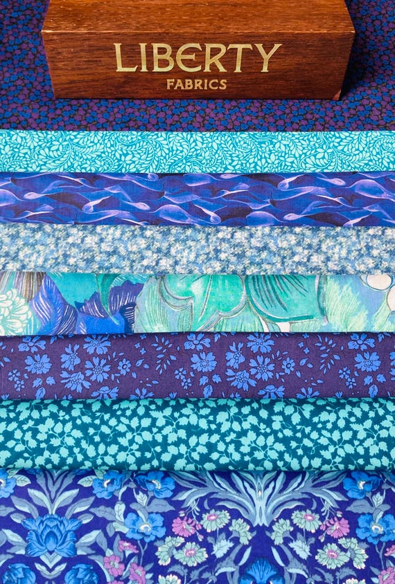 Liberty Tana Lawn “Sea of Turquoise” Fabric Pack. They contain 8 generous pieces of discontinued fabrics, cut to a 6”x 9” size.