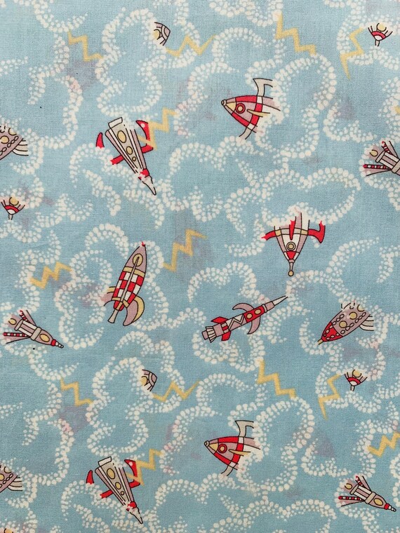 Novelty Blue and Red Vintage Liberty Tana Lawn Fabric called ‘Rocket Dance’ 13”x 9”. I offer international shipping.