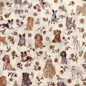 May include: A white fabric with a repeating pattern of various dog breeds and small brown flowers. The dogs are drawn in a vintage style and are in various poses.