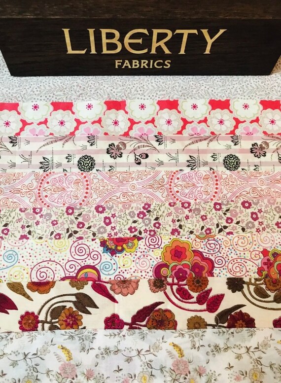 A Beautiful, Liberty Tana Lawn ‘Pink Mix’ fabric pack. This bag contains 8 fabulous, rare, vintage cottons cut to a size of 6”x 9”
