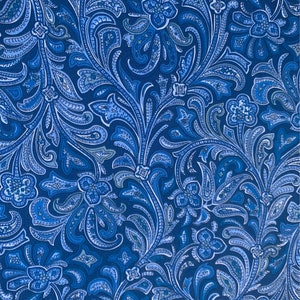 May include: A blue paisley fabric with a white and light blue floral pattern.