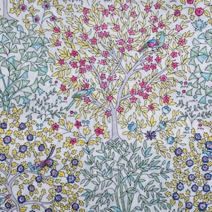 May include: A fabric with a repeating pattern of trees, flowers, and birds. The trees have pink blossoms and yellow leaves, with blue and pink birds perched on the branches. The background is white, and the overall design is detailed and colorful.