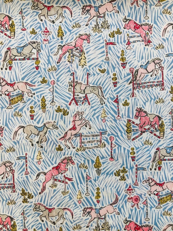 Gymkhana, A Novelty Horse Design of Liberty Tana Lawn. This is a Blue and Pink colourway/2019 cut to a generous 13 x 9”