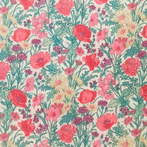 May include: A vibrant floral pattern with a white backdrop, showcasing a mix of flowers in pink, red, and yellow hues. The design includes poppies, daisies, and other blooms with green and teal leaves.