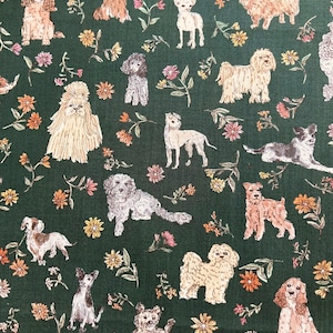 May include: A green fabric with a repeating pattern of various dog breeds in different poses. The dogs are drawn in a cartoon style with brown, white, and black fur. The background is a dark green with small white flowers.