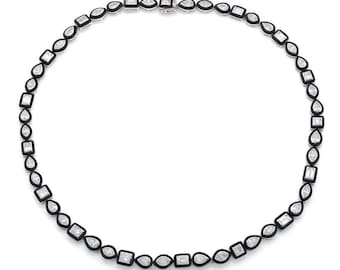 May include: A black and white diamond necklace with a variety of shapes and sizes. The diamonds are set in a black enamel setting.