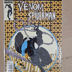以下が含まれることがあります： ヴェノムとスパイダーマンがバトルシーンを描いたコミックの表紙。表紙は黄色で、黒い文字で「True Believers #1」と「Venom vs Spiderman」と書かれている。