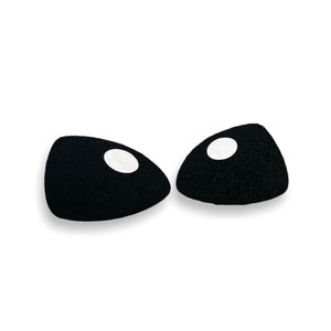 May include: Two black felt eyes with white pupils, commonly used for craft projects.