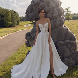 Sleeveless Strapless Minimalist Modest Plain Sweetheart neckline Corset Open back A-line Pleated Slit skirt Court train Wedding Dress Gown