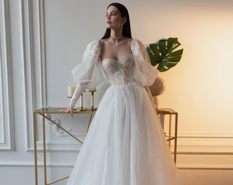 Romantic Light Puffy spacious Long sleeves Delicate cuffs Tulle Skirt Court Train Glitter Lace Tulle A-line Wedding dress