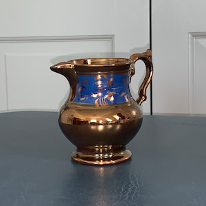 Antique copper luster ware pitcher