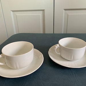 Antique cups and saucers, white ironstone cups