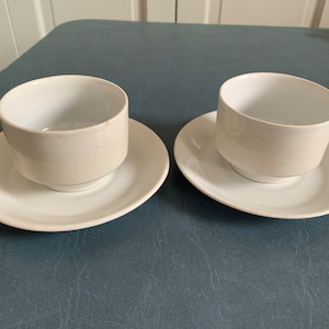 Antique cups and saucers, white ironstone cups