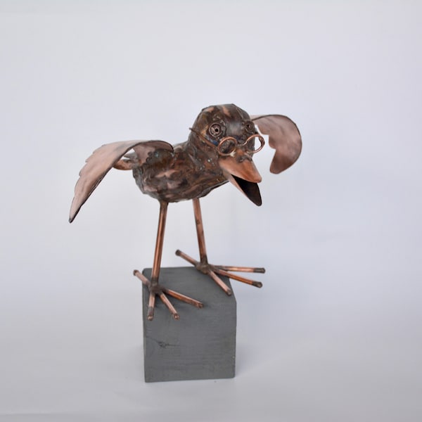 Little cheeky raven made of copper