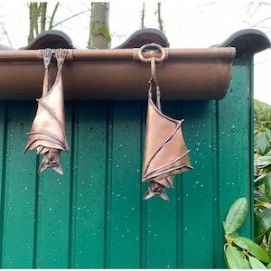 2 cute bats for the gutter in a set
