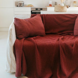 Linen waffle blanket in Terracotta. Sofa cover in Red. Linen waffle bedspread