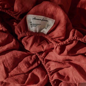 Linen fitted sheet in Terracotta. Deep linen fitted sheet