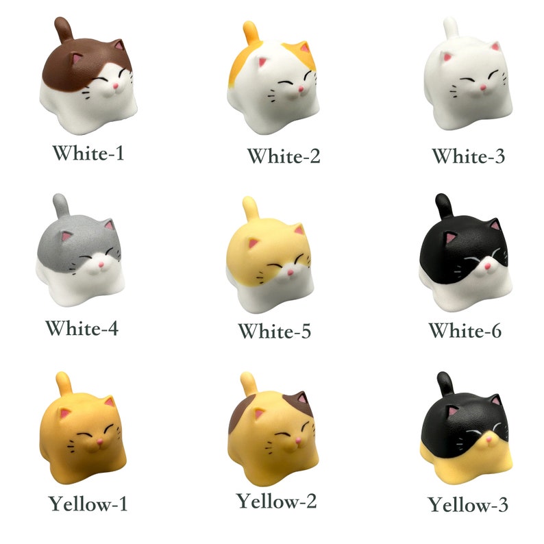 May include: Nine small ceramic cat figurines in various color combinations. The cats are all in a sitting position with their heads tilted down. The colors include white, gray, black, brown, and yellow.