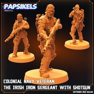 May include: Three tan-coloured miniature figures of a Colonial Navy Veteran, "The Irish Iron Sergeant With Shotgun." The figures are posed in different stances, each holding a shotgun. The text "Papsikels" and "September 2022 Release" are visible.