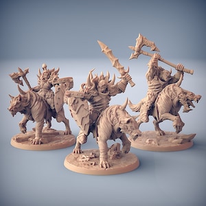May include: Three unpainted miniature figures of orcs riding wolves. Each orc is holding a weapon and wearing armor. The figures are posed in a dynamic action stance.