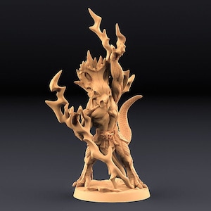 May include: A detailed miniature figurine of a creature with a reptilian body, humanoid torso, and antlers. The creature holds a staff with a forked end. The figurine is painted in a light brown color and is standing on a circular base.