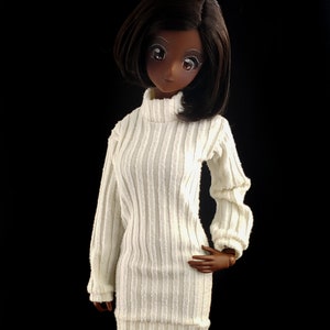 May include: A white ribbed turtleneck sweater dress with long sleeves and a fitted silhouette.