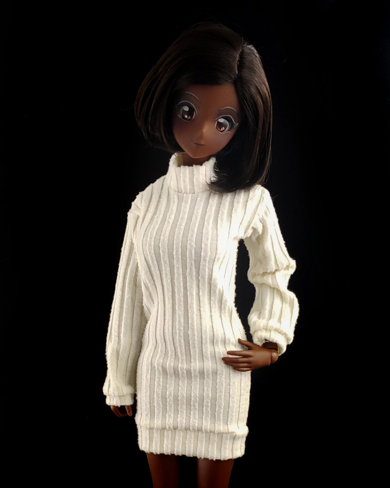 May include: A white ribbed turtleneck sweater dress with long sleeves and a fitted silhouette.