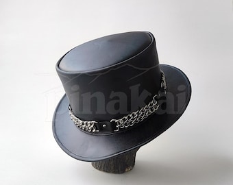 May include: A black leather top hat with a silver chain detail around the brim.