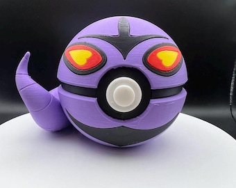 May include: A purple and black 3D printed Pokemon figure of a Ghost type Pokemon. The figure has red eyes with yellow accents and a white Pokeball design on its chest.