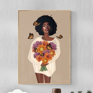 May include: Digital art print of a Black woman with an afro holding a bouquet of orange and purple flowers. Butterflies are flying around her. The print has a light brown background and the artist's signature "Rahima Szila" is in the bottom right corner.