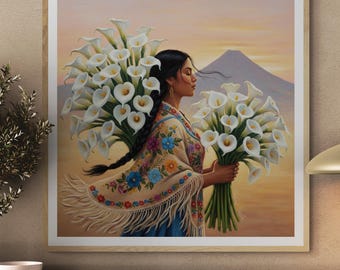 May include: A framed art print shows a woman with bouquets of white calla lilies. She is wearing a colourful shawl with floral embroidery. A mountain is visible in the background, set against a warm, sunset-like sky.