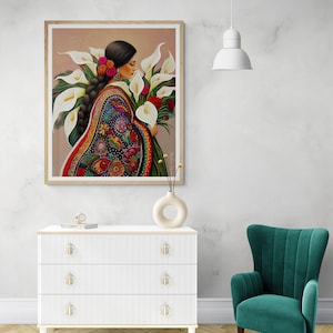 May include: A painting of a woman in a colourful embroidered dress holding a bouquet of white calla lilies.