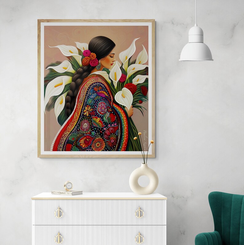 May include: A painting of a woman in a colourful embroidered dress holding a bouquet of white calla lilies. The woman has long dark hair and is wearing a floral crown. The background is a light brown.