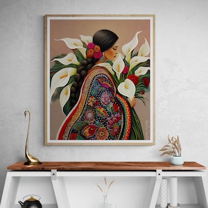 May include: A painting of a woman wearing a colourful embroidered dress and holding a bouquet of white calla lilies. The background is a soft peach colour.