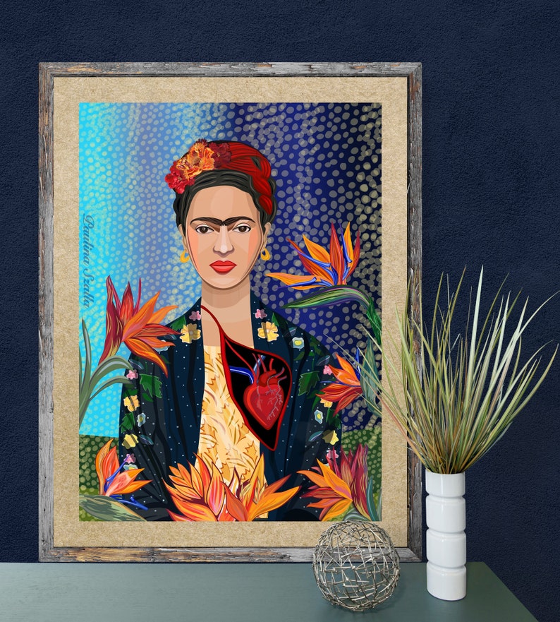 May include: A framed illustration of Frida Kahlo with a red heart and flowers. The background is a blue and black pattern.