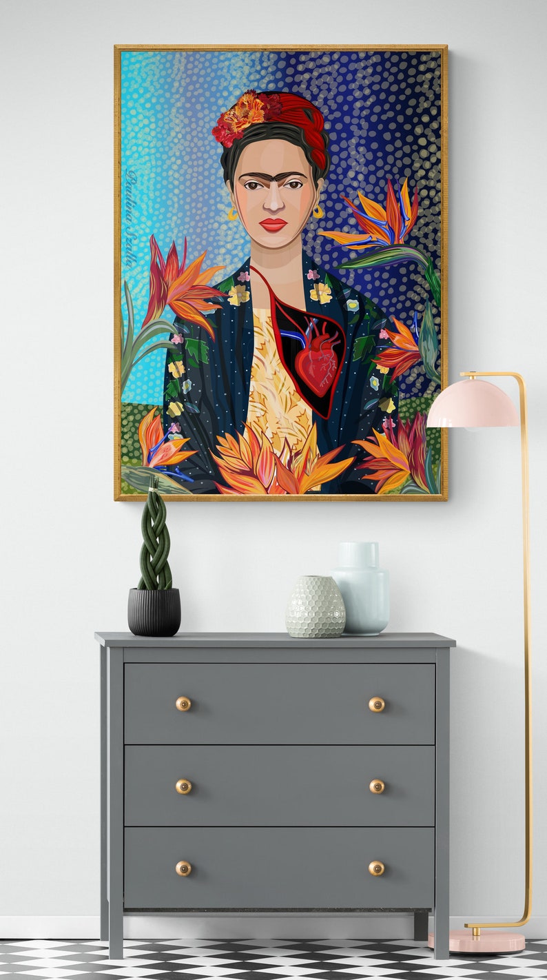 May include: A framed illustration of Frida Kahlo with a red heart and flowers. The background is a blue and white pattern.