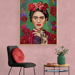 May include: A framed illustration of a woman with dark hair and a flower crown. She is wearing a red and blue patterned shawl and has butterflies on her hand. The background is green with red flowers.