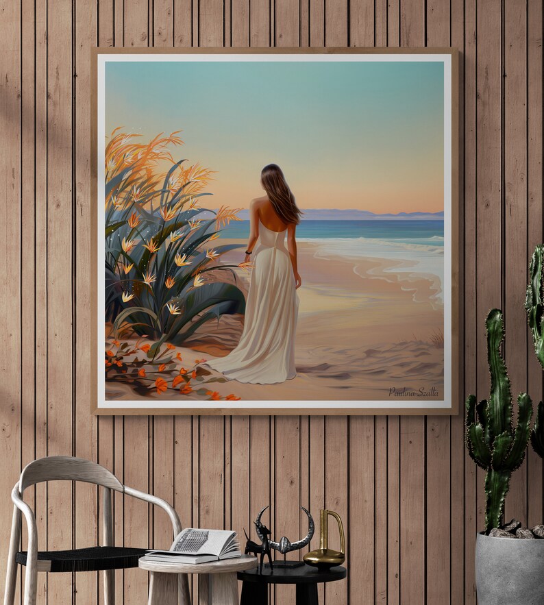 May include: A painting of a woman in a white dress walking on a beach with a lush green plant in the foreground. The sky is a soft blue with a hint of orange in the distance. The painting is signed "Pamela Scott" in the bottom right corner.