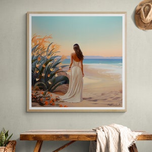 May include: A woman in a white dress walks along a sandy beach with her back to the viewer. The ocean is in the background and there are tall green plants with orange flowers in the foreground. The sky is a light blue with a hint of pink.