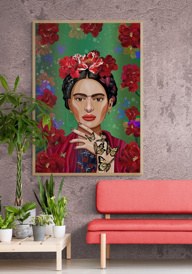 May include: A framed illustration of Frida Kahlo with a floral crown and butterflies on her hand against a green background.