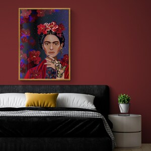 May include: A framed painting of a woman with a flower crown and butterflies on her hand. The background is a dark blue with red flowers.