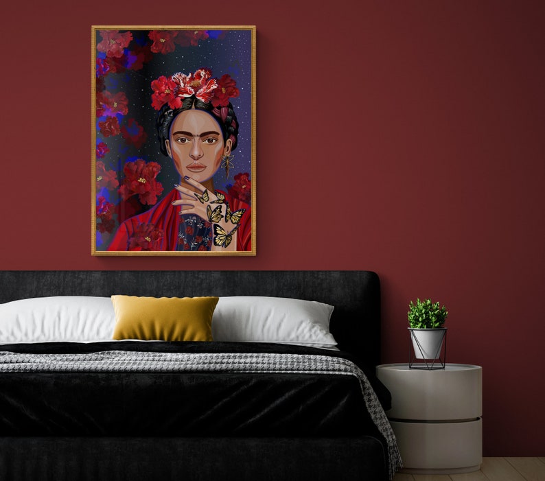 May include: A framed painting of a woman with a flower crown and butterflies on her hand. The background is a dark blue with red flowers.