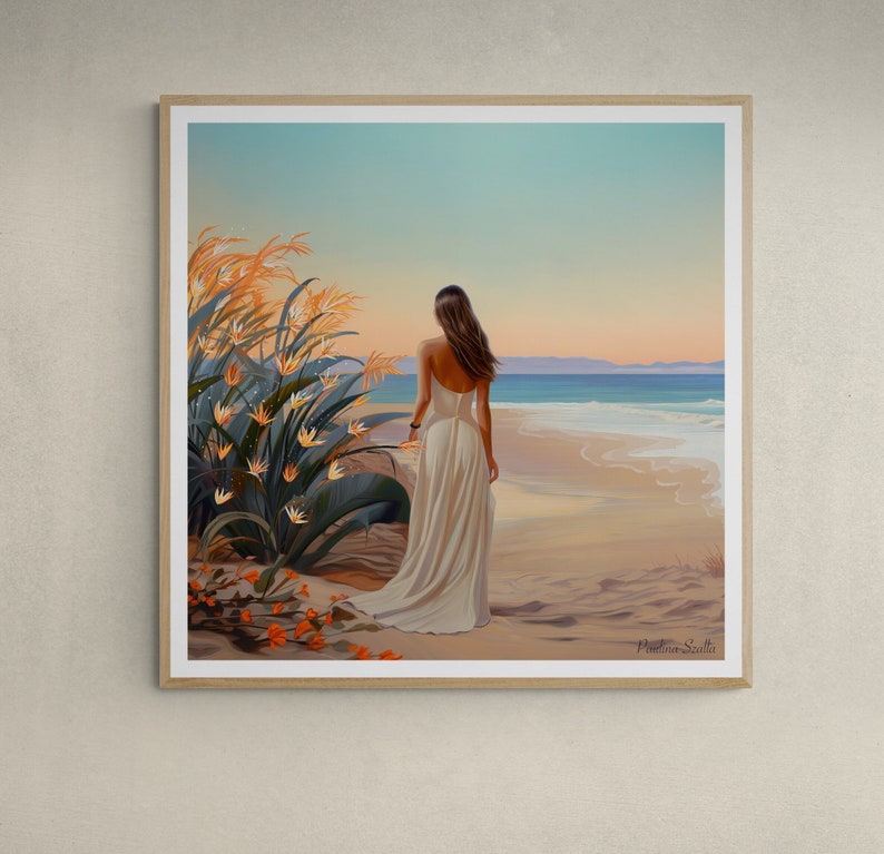 May include: A woman in a white dress walks along a sandy beach with a blue ocean in the background.  The woman is facing away from the viewer and has long brown hair.  There are orange flowers in the foreground.
