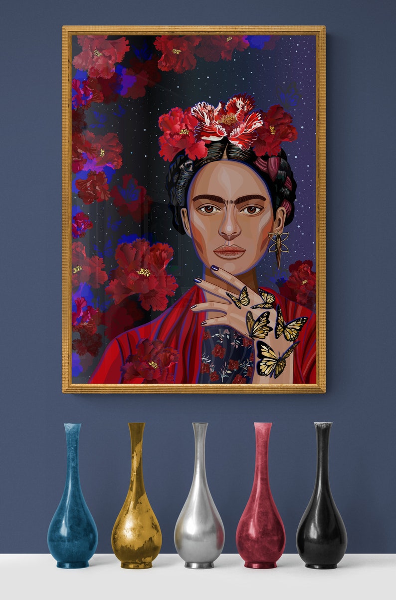 May include: A framed illustration of a woman with dark hair and a red floral crown. She is wearing a red and black patterned blouse and has butterflies on her hand. The background is a dark blue with stars and red flowers.